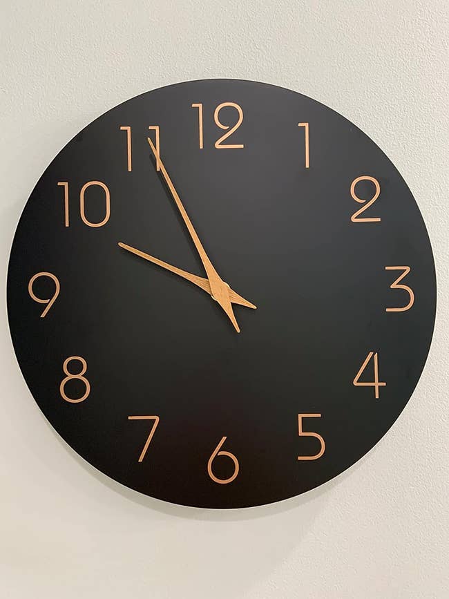 reviewers black clock with gold numbers