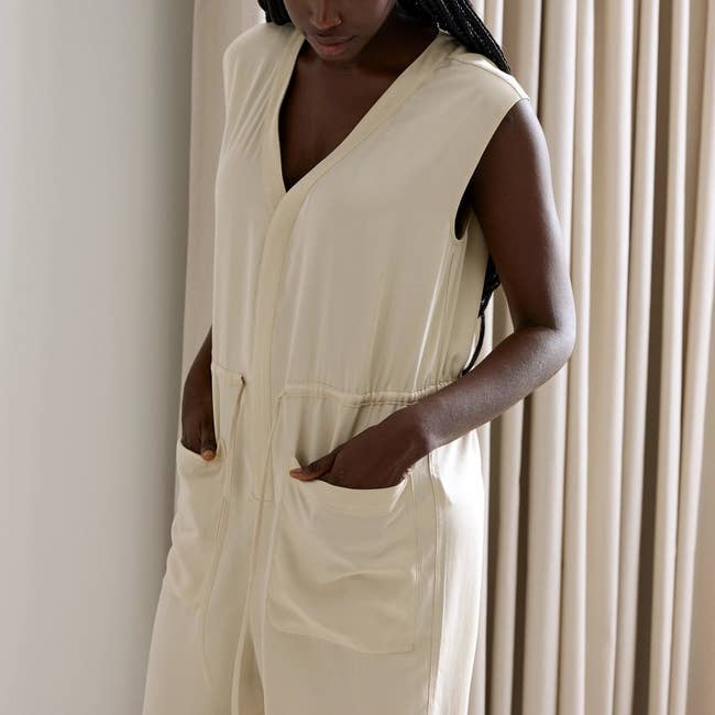 model wearing the white jumsuit