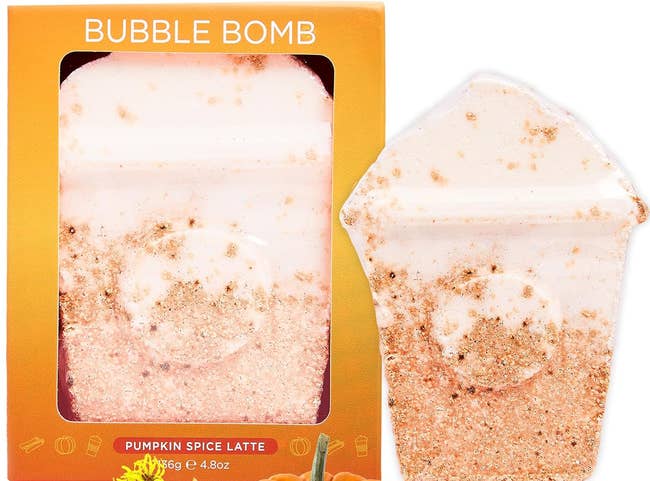 Bubble Bomb Pumpkin Spice Latte bath weaponry shaped similar a java cup, with spices, a pumpkin, and flowers astir it