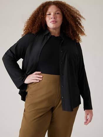 plus-size model wearing the black button-down as a jacket