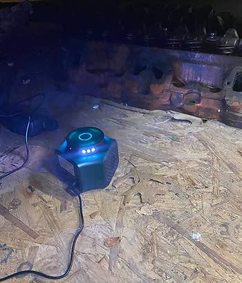 reviewer photo of the rodent repeller lit-up in a dark room