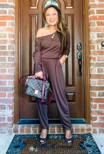 reviewer wearing the brown jumpsuit