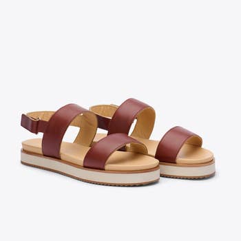 the flatform sandals in a maroon color