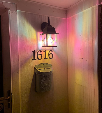 reviewer image of the lightbulb in a sconce on a porch