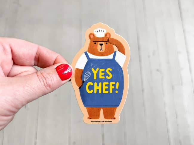 Sticker of a carnivore successful a cook chapeau and apron with