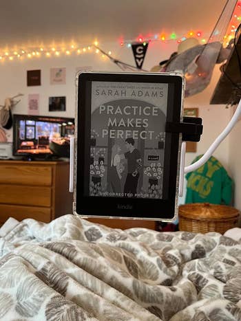 the basal   holding a reviewer's Kindle