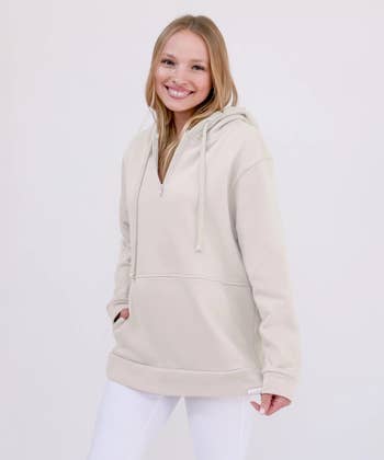 model wearing the beige hoodie