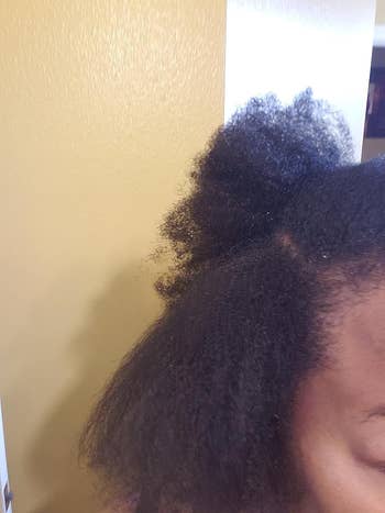 person with 4c hair with a section of hair blown out