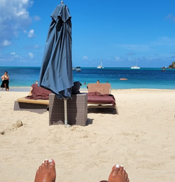 A reviewer wearing one on their ankle at the beach