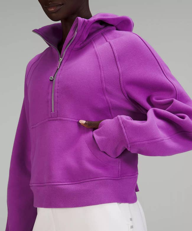 model wearing the magenta-colored hoodie