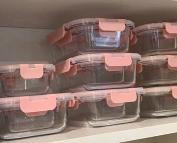 reviewers containers in pink stacked empty on shelf