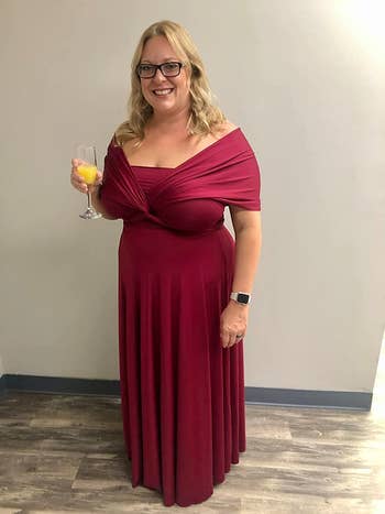 reviewer wearing the burgundy color as an off-the-shoulder dress
