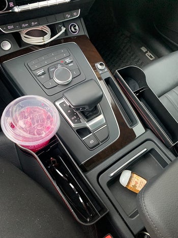 A overhead view of the gap filler with a drink in the holder