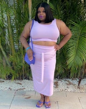 reviewer wearing the lavender skirt set