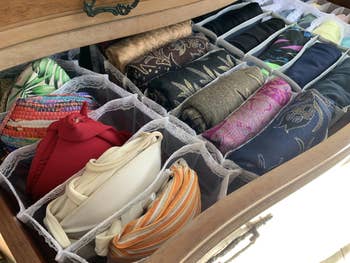 organized folded scarves in a drawer