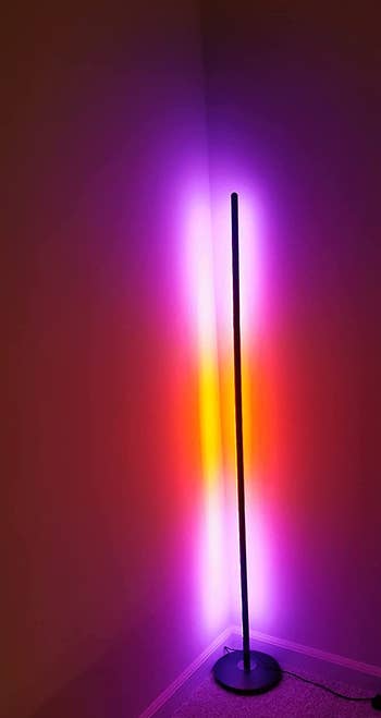 reviewer image of the standing lamp with pink and orange light