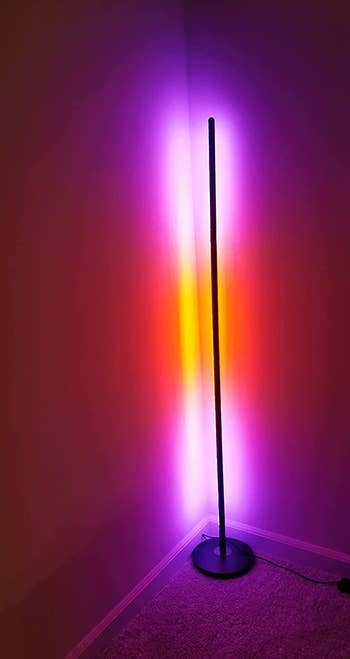 reviewer image of the standing lamp with pink and orange light