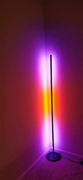 reviewer's standing lamp with pink and orange light