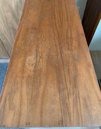 a reviewer's wooden table looking scratched up 