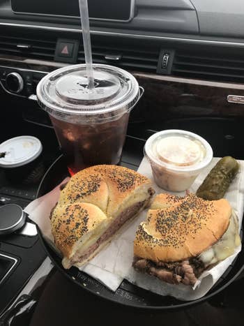 reviewer image of tray installed with a full sandwich, drink, dip, and pickle on top