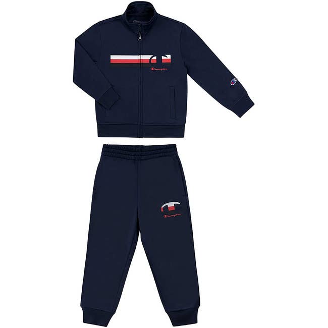 a two piece navy sweat set with the champion logo on it
