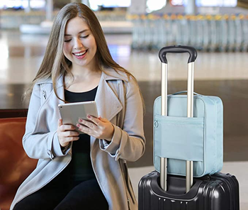 model with shoe pouch on top of luggage