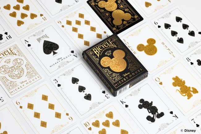 gold and black mickey embossed playing cards