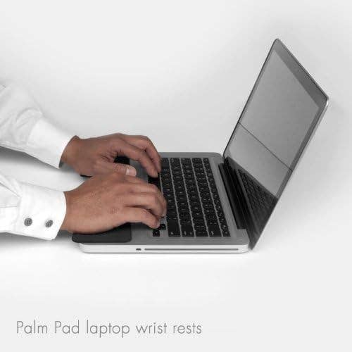 Person using Palm Pad wrist rests while typing on a laptop, ideal for ergonomic support