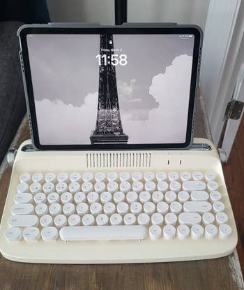a reviewer's ipad in the beige keyboard