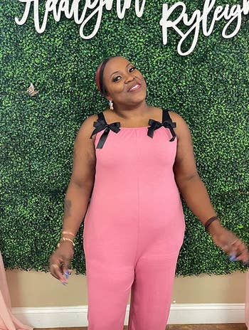 reviewer wearing the pink jumpsuit