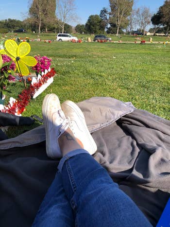 reviewer photo on picnic blanket in cemetery