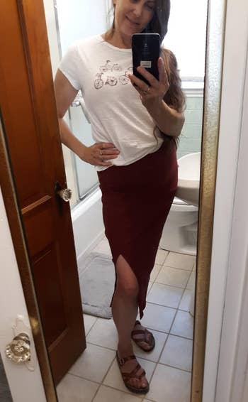 a reviewer wearing the skirt in dark red 