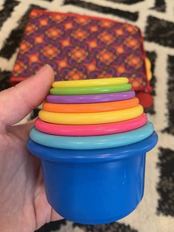 a stack of rainbow toycups