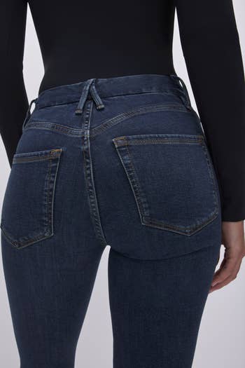 close up of a different model showing off the back of the jeans