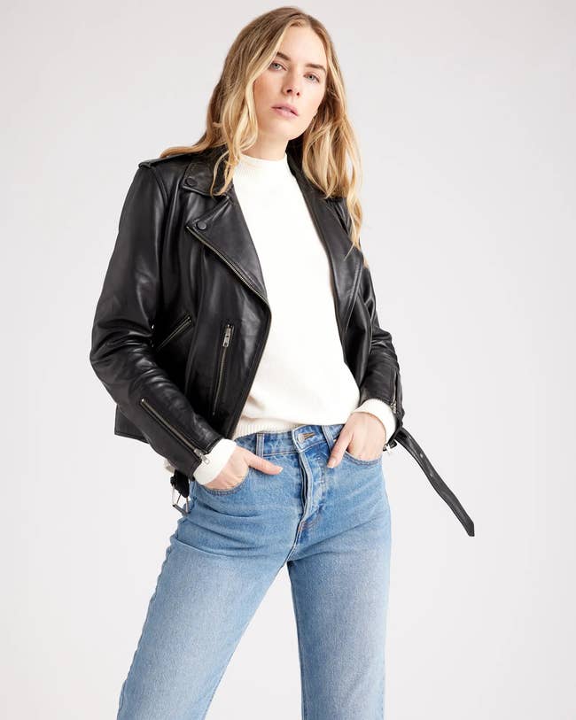model wearing the black leather jacket