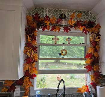 Kitchen model adorned with autumn leaves