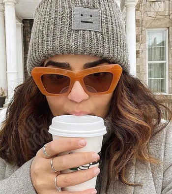 a different model wearing the amber-colors frames