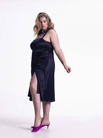 plus-size model wearing the black version with magenta heels