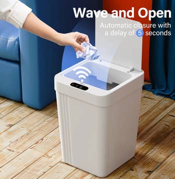 Person uses a astute  trash tin  with question  sensor for touchless opening   and a 5-second automatic closure, disposable   successful  a location  setting