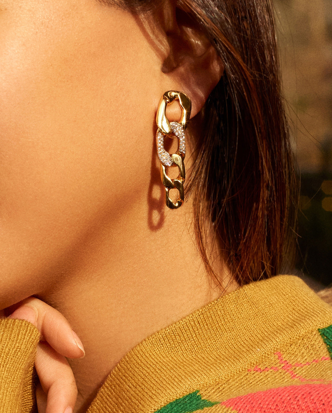 model in gold four chain link drops with one pave link