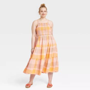 Model wearing the orange plaid dress