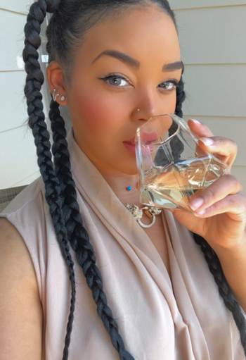 reviewer drinking fro diamond-shaped tumbler