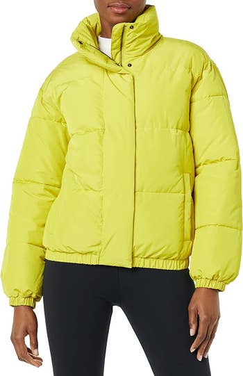 model in bright yellow jacket