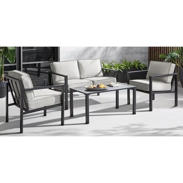 2 outdoor chairs, 1 outdoor couch with cushions around table