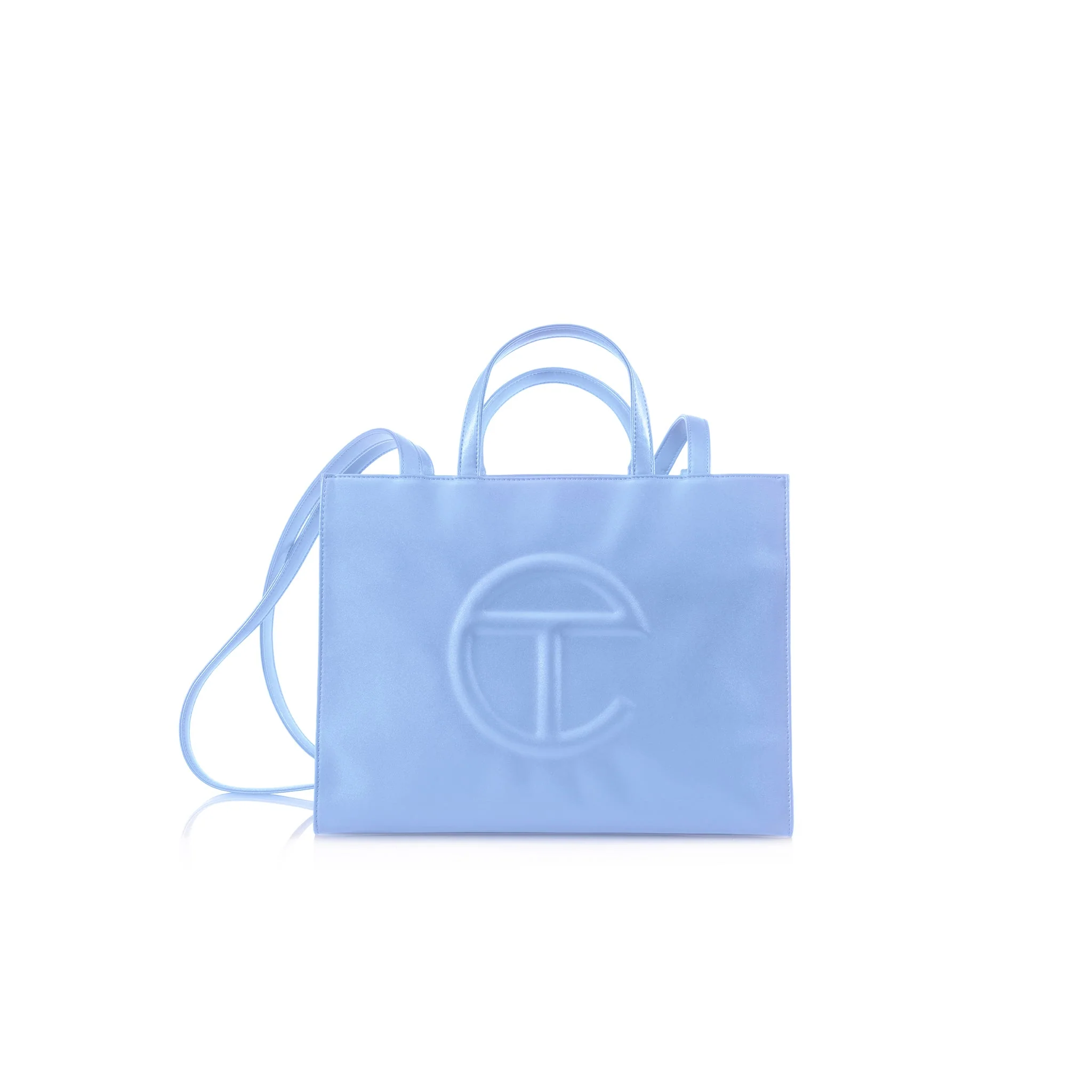 A stylish handbag with dual handles and a enarthrosis  strap featuring a salient  embossed logo connected  the front