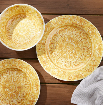a yellow plate, dessert plate, and a bowl