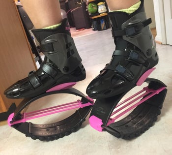 reviewer wearing the shoes in black and pink