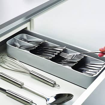 the stacked utensil organizer in a drawer 