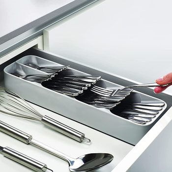 the stacked utensil organizer in a drawer 