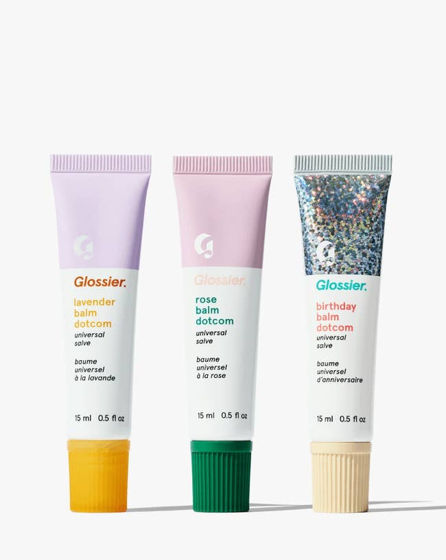 three different flavors of Glossier lip balms